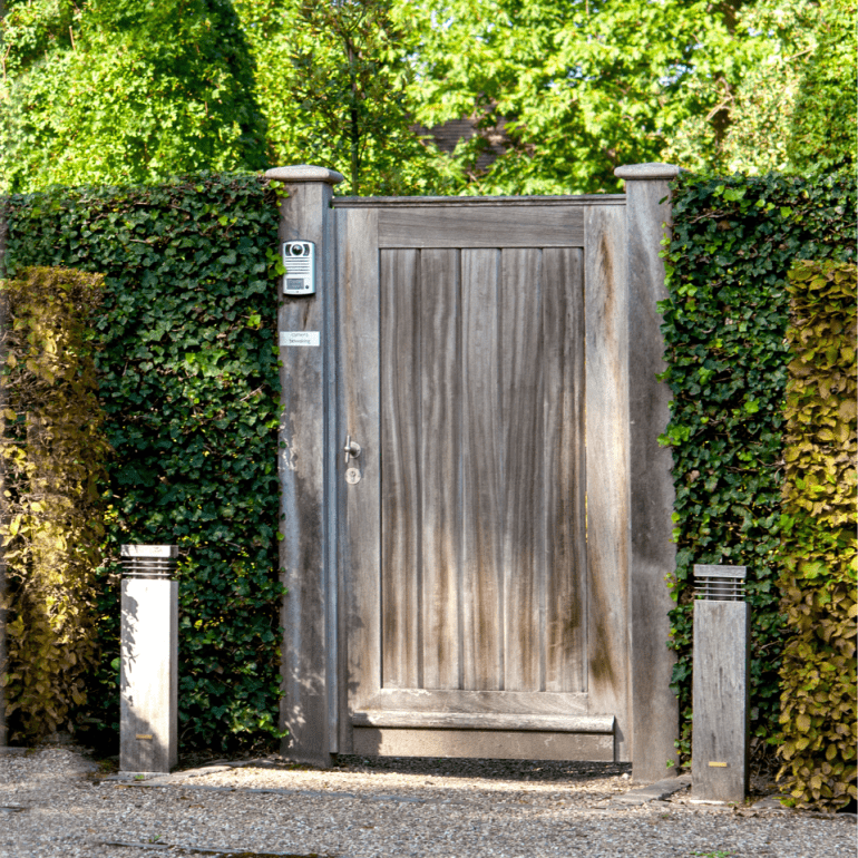A garden wooden door with an intercom system