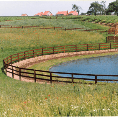 Curved wooden fences with three rails screwed to the square posts