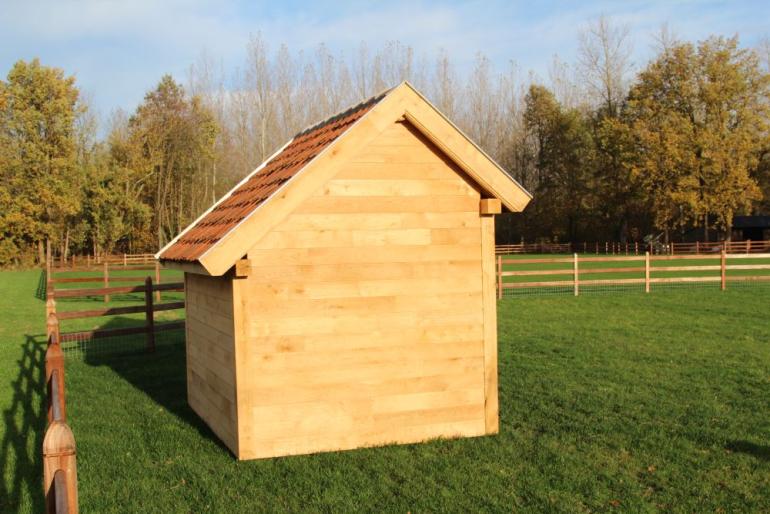 A wooden shelter for small outdoor animals