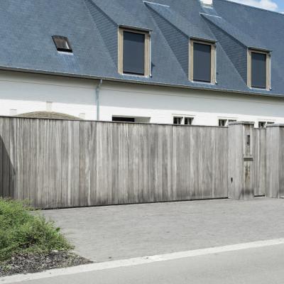 A wooden driveway gate